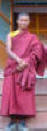 Kate with monk in front of monastery.jpg